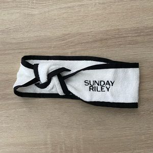 Brand new exclusive Sunday Riley headband. Twist front, Velcro back. Skincare